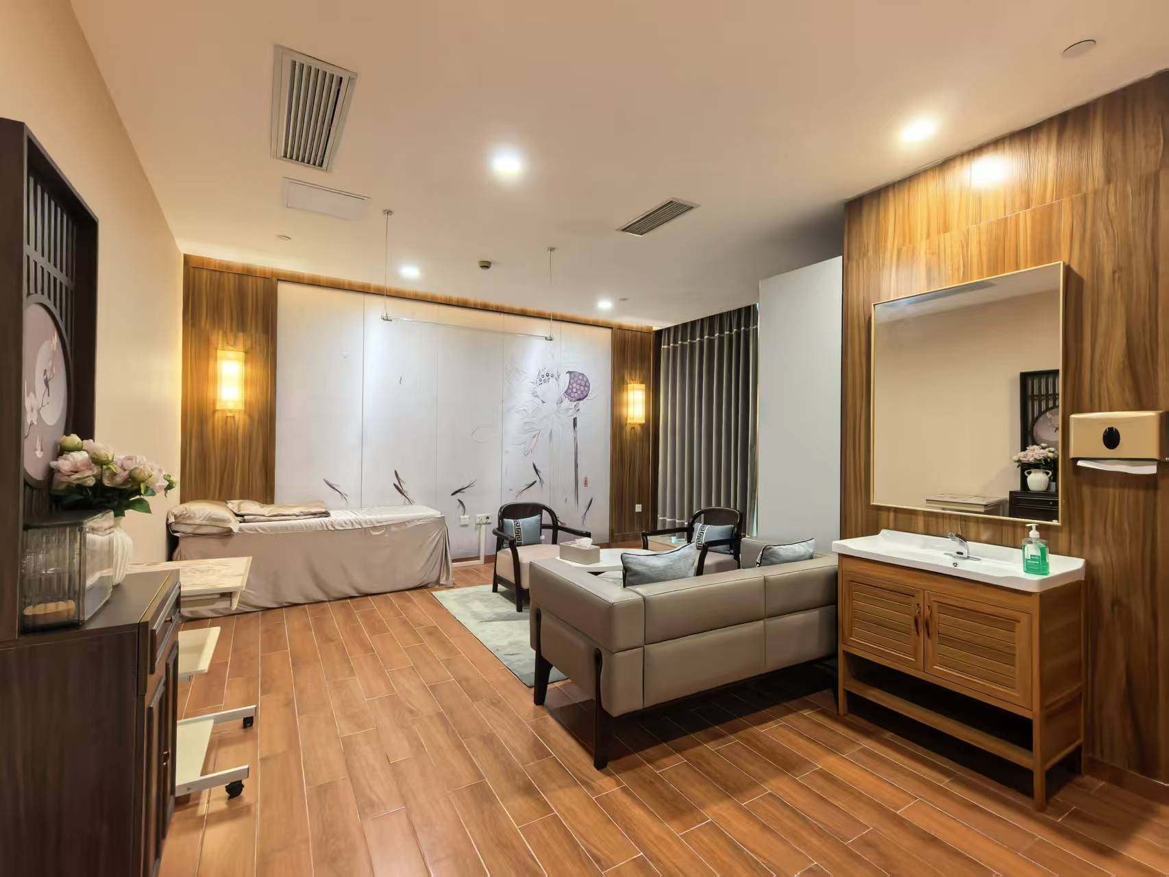 Client-supplied photograph of a private examination room with seating and a washbasin